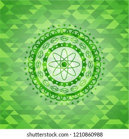 atom icon inside green mosaic emblem