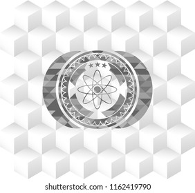 atom icon inside grey badge with geometric cube white background
