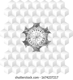 atom icon inside grey badge with geometric cube white background