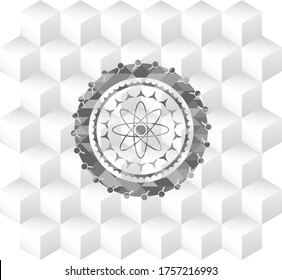 atom icon inside grey badge with geometric cube white background. 