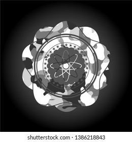 atom icon inside grey camo emblem