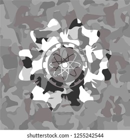 atom icon inside grey camouflage texture