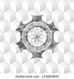 atom icon inside grey emblem with geometric cube white background