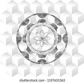 atom icon inside grey emblem with geometric cube white background
