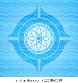 atom icon inside light blue water wave emblem.