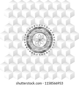 atom icon inside realistic grey emblem with geometric cube white background