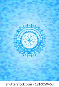 atom icon inside realistic sky blue emblem. Mosaic background