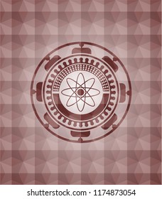 atom icon inside red seamless geometric badge.