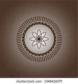 atom icon inside retro style wooden emblem