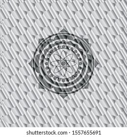 atom icon inside silver color badge. Scales pattern. Vector Illustration. Detailed.