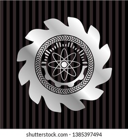 atom icon inside silver shiny badge