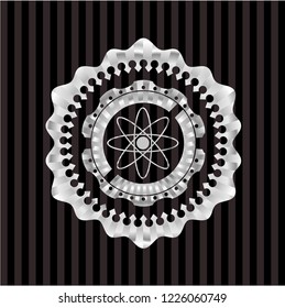 atom icon inside silvery shiny badge