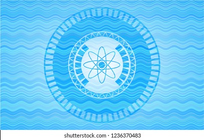 atom icon inside sky blue water badge background.