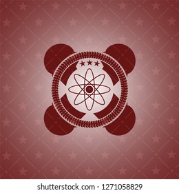 atom icon inside vintage red emblem