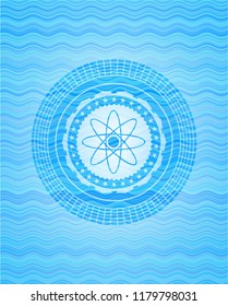 atom icon inside water concept emblem.