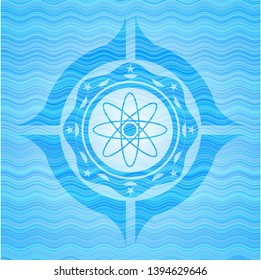 atom icon inside water concept style emblem.
