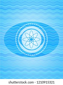 atom icon inside water wave concept style emblem.