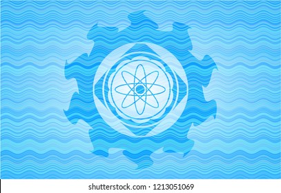 atom icon inside water wave concept badge.