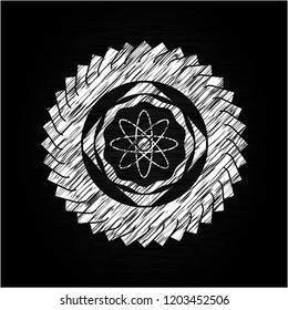 atom icon on chalkboard