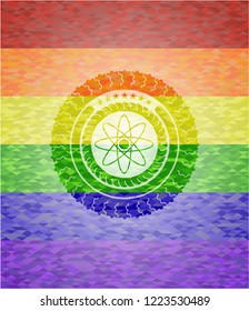 atom icon on mosaic background with the colors of the LGBT flag