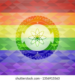 atom icon on mosaic background with the colors of the LGBT flag