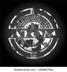 Atom on grey camouflaged texture