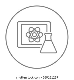 Atom sign drawn on board and flask line icon.