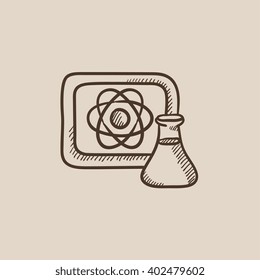 Atom sign drawn on board and flask sketch icon.