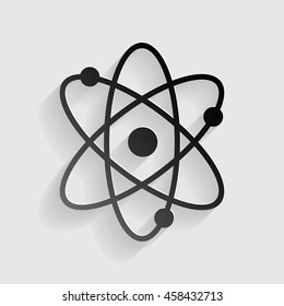 Atom sign illustration. Black paper with shadow on gray background.