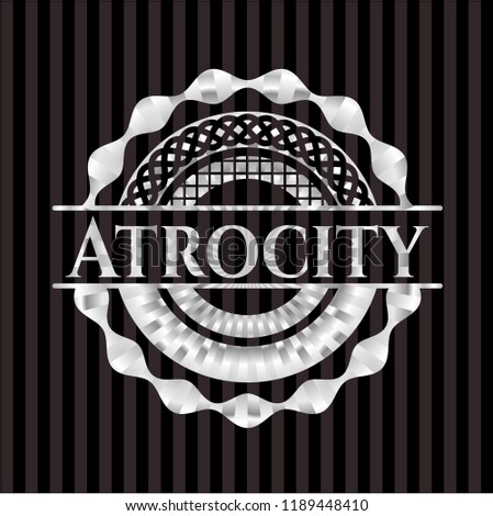 Atrocity silver emblem or badge