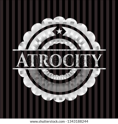 Atrocity silver emblem or badge