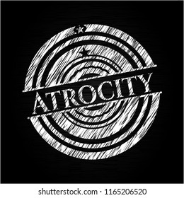 Atrocity written with chalkboard texture