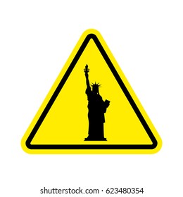 Attention America. Statue of Liberty on yellow triangle. Road sign  Caution USA