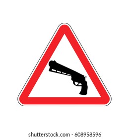 Attention crime. Gun in red triangle. Road sign Caution Weapon