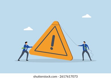 Attention message, businessman pushing exclamation triangle attention sign.