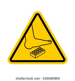 Attention Plastic construction Detail. Warning yellow road sign. Step onto the Constructor. Caution Forbidding Detail Plastic Designer.  