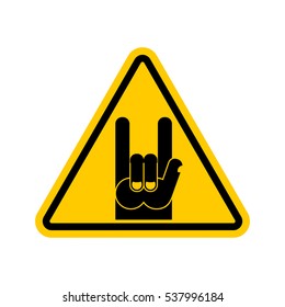 Attention rock music. Warning rock hand symbol. Danger road sign yellow triangle