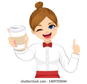 Attractive barista waitress woman in uniform holding takeaway coffee and making positive thumb up isolated on white background 