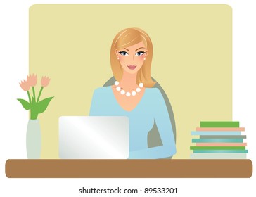 Attractive business woman working on her laptop computer