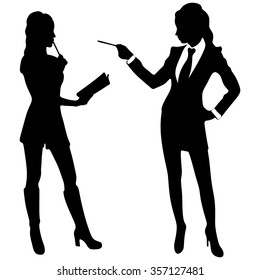 Attractive businesswoman pointing with pencil to another girl, working concept