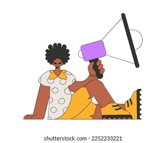 Attractive man is sitting on the floor and holding a megaphone.