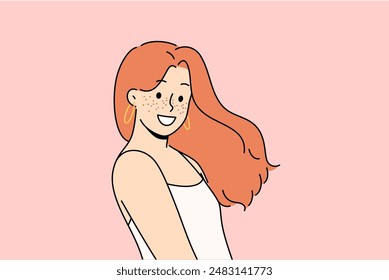 Attractive woman with freckles on face smiles and looks at screen demonstrating natural beauty without using makeup. Cheerful teenage girl with freckles experiences sparkling emotions and smiles