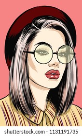 Attractive woman with rounded glasses in red hat