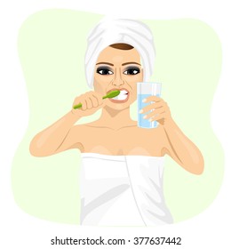 Attractive Young Woman Brushing Teeth