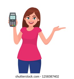 Attractive young woman/girl showing pos terminal or credit/debit cards swiping machine and gesture hand to copy space side away. Wireless modern bank payment concept illustration in vector cartoon.