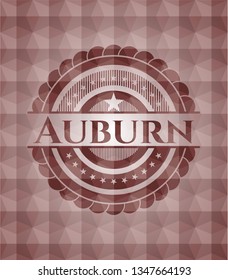 Auburn red seamless emblem or badge with abstract geometric pattern background.