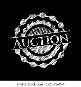 Auction written on a chalkboard
