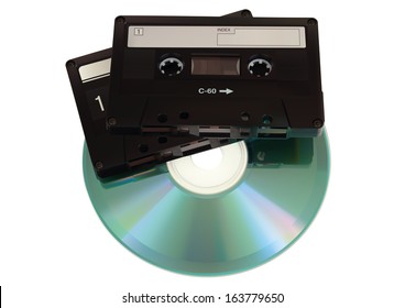 Audio cassettes with CD disk over white Background