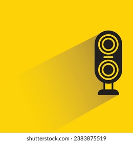 audio loudspeaker with shadow on yellow background
