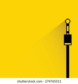 audio plug on yellow background, flat and shadow theme